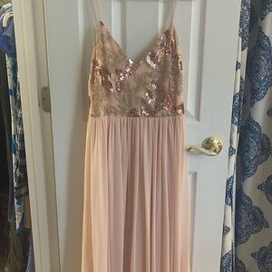 Never worn. Beautiful floor length gown with side slip and beaded detail.
